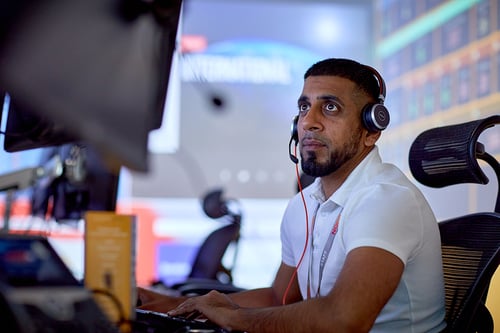Man sitting at a computer in a support room